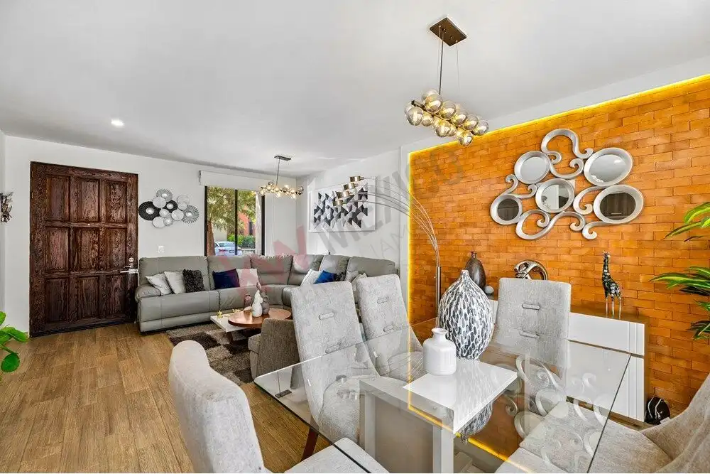 Spacious living room with contemporary decor, large windows, and stylish furniture in a modern home.