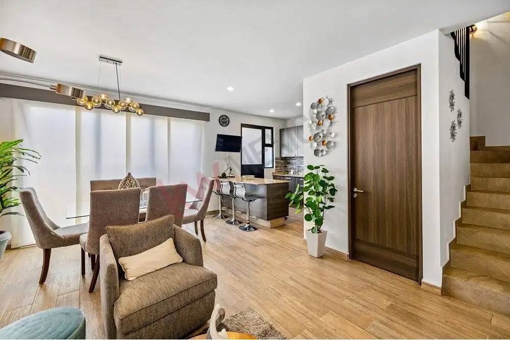 Bright living room with contemporary furniture and large windows in Quinta de Allende.