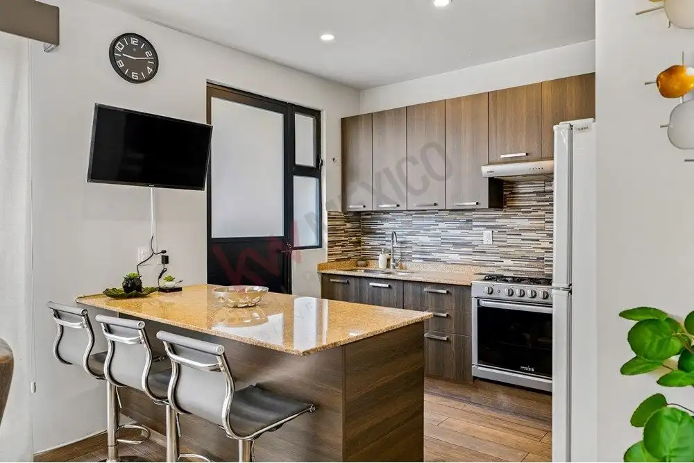 Bright modern kitchen with wooden cabinets and a stylish backsplash.