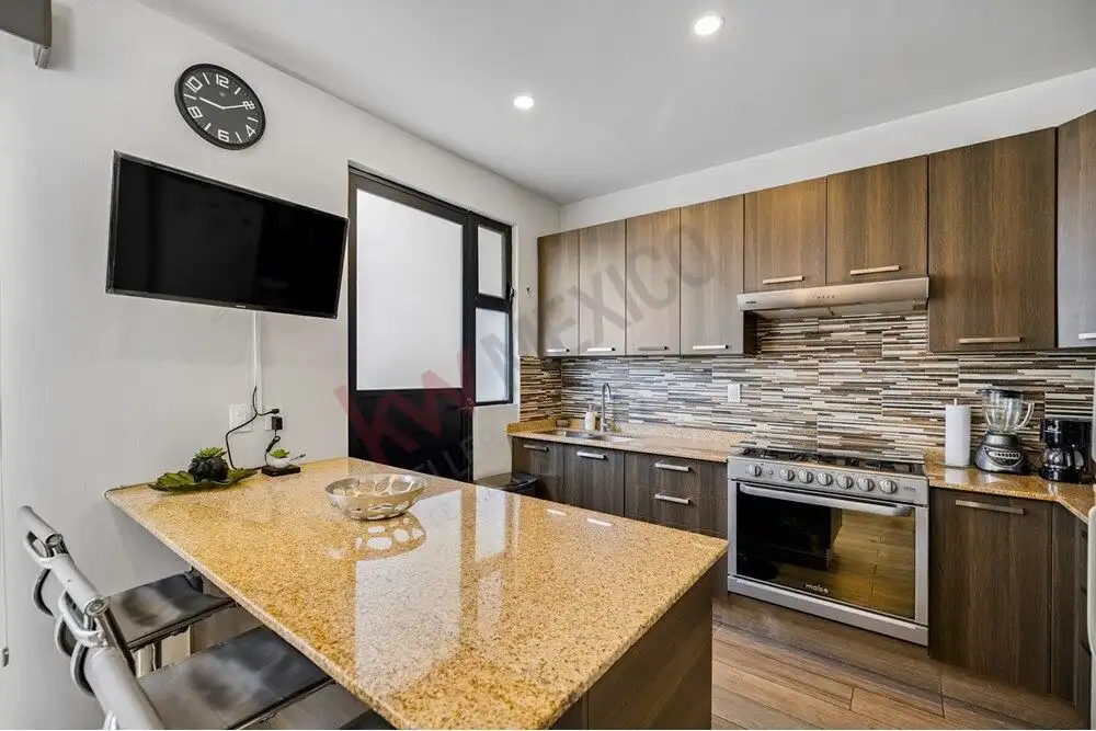 Modern kitchen featuring wooden cabinets, a stainless steel stove, and a tiled backsplash. Bright, c.
