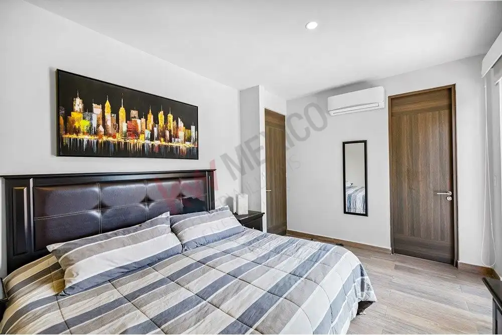 Beautiful bedroom with modern decor and city skyline artwork in Quinta de Allende. Move-in ready hom.