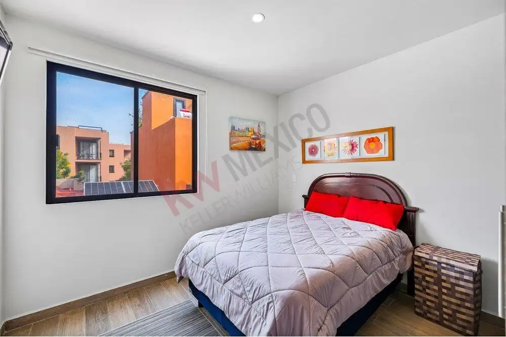 Bedroom with large window and city views in Quinta de Allende.