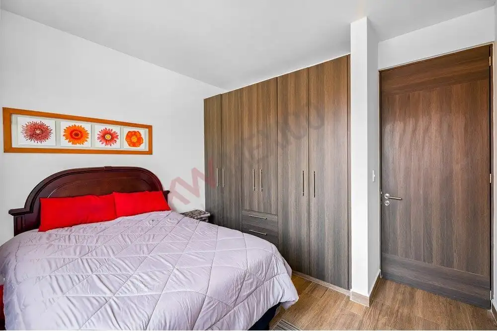 Beautiful bedroom with modern decor and ample storage in Quinta de Allende, San Miguel de Allende. M.