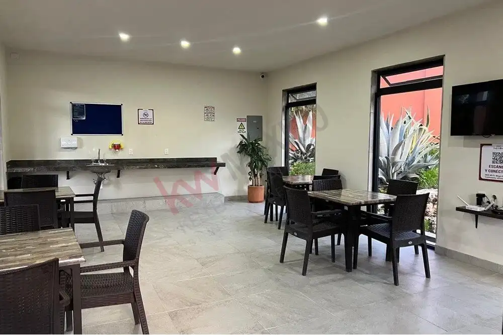 Interior view of a modern, move-in ready home with stylish furniture and large windows.