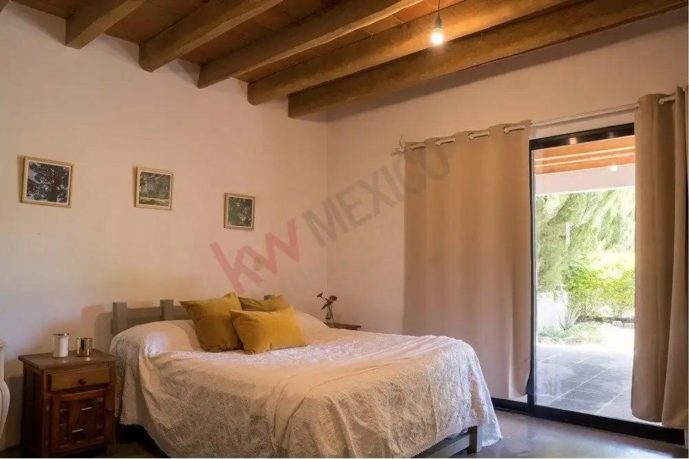 Modern Bedroom with Wooden Ceiling in Rancho Los Labradores Modern bedroom with wooden ceiling and large sliding glass door in Rancho Los Labradores, San Miguel.