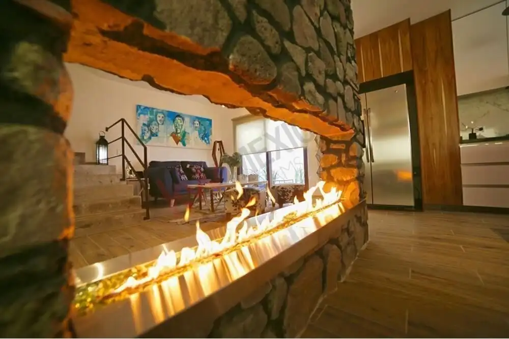 Charming living space featuring a modern fireplace, cozy seating, and artistic decor in a stylish ho.