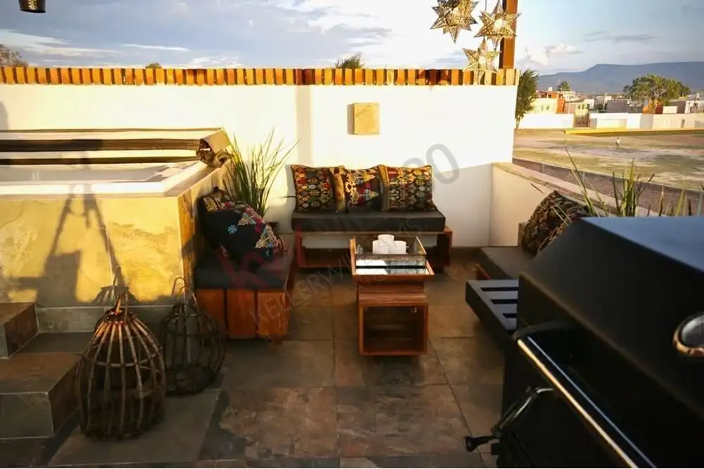 Rooftop terrace with Jacuzzi, outdoor seating, and scenic views in San Miguel de Allende. Perfect fo.