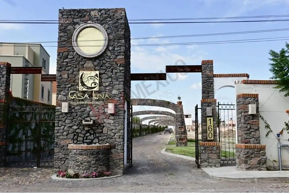 Stone entrance gate with Casa Luna sign in San Miguel de Allende.
