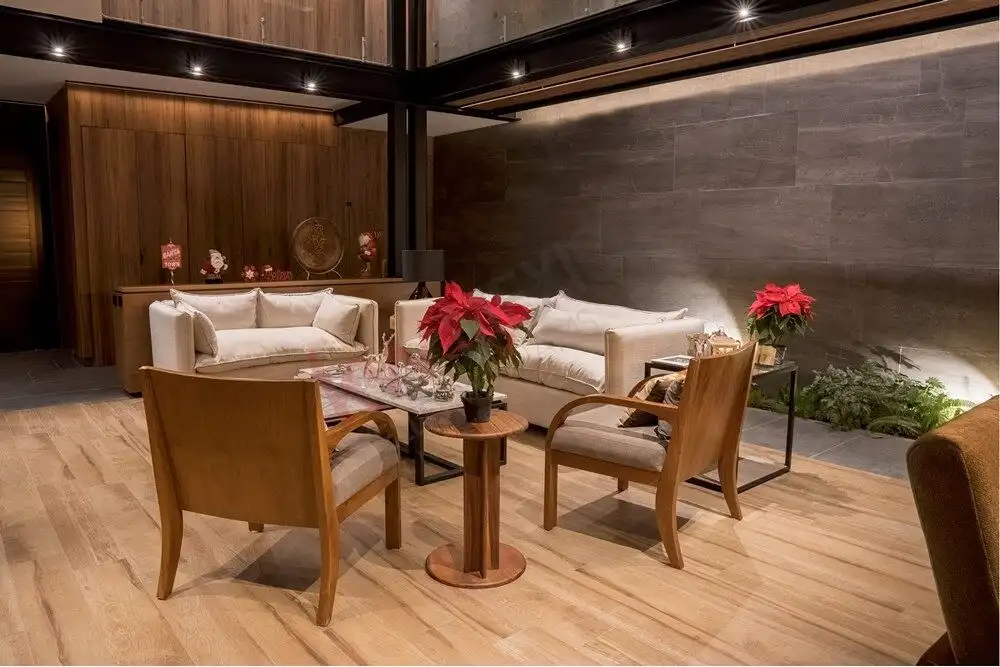 Luxury Home Living Room with elegant furniture and festive poinsettias.