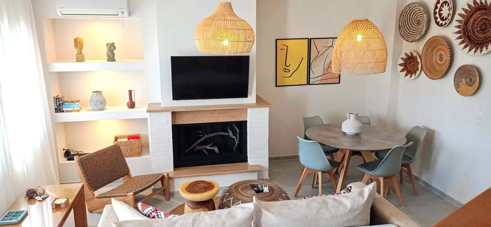 Elegant living room featuring contemporary furniture, a cozy fireplace, and stylish wall art in a lu.