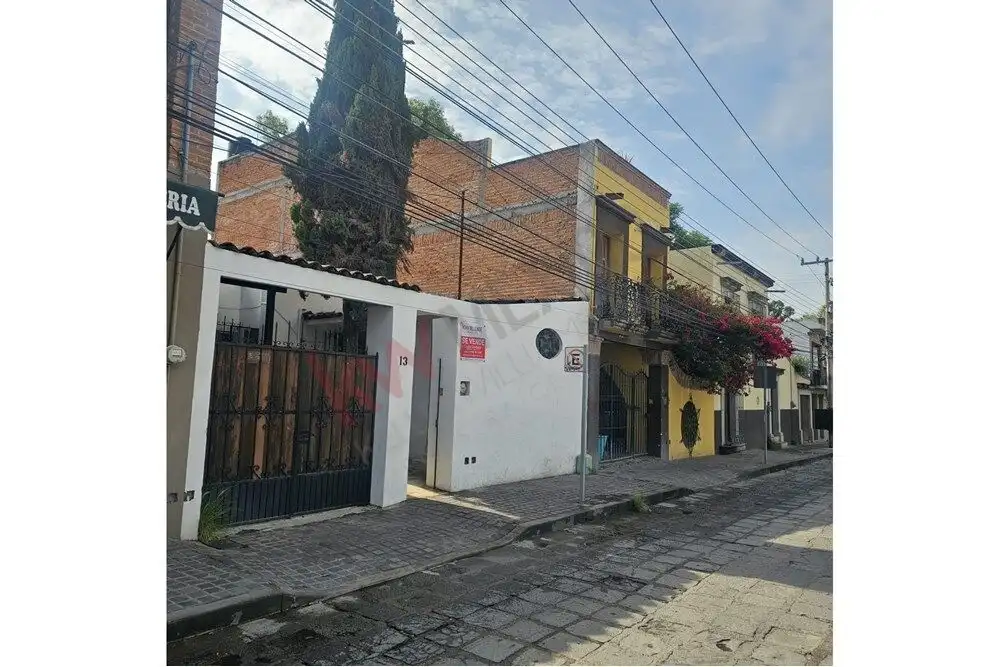 story house near San Miguel de Allende center Single-story house with colorful exterior and garden near San Miguel de Allende.