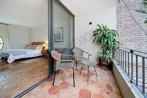 Balcony view of bedroom with outdoor seating in a home for sale in Colonia Guadalupe, San Miguel de.