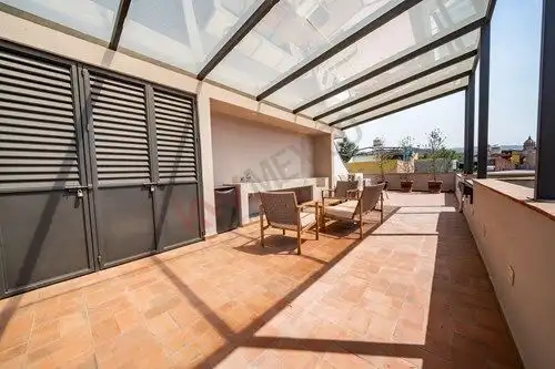 Rooftop terrace with seating area and glass roof in Colonia Guadalupe, San Miguel de Allende.