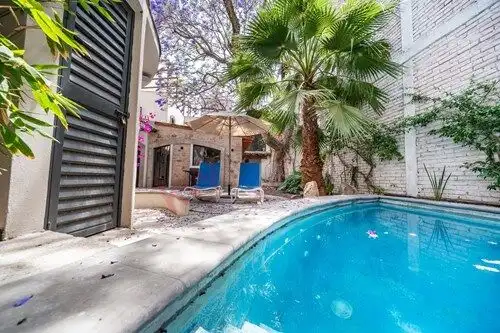 Pool and garden view of a home for sale in Colonia Guadalupe, San Miguel de Allende.