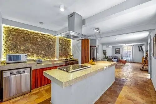 Bright interior with modern kitchen and cozy living area in Colonia Guadalupe.