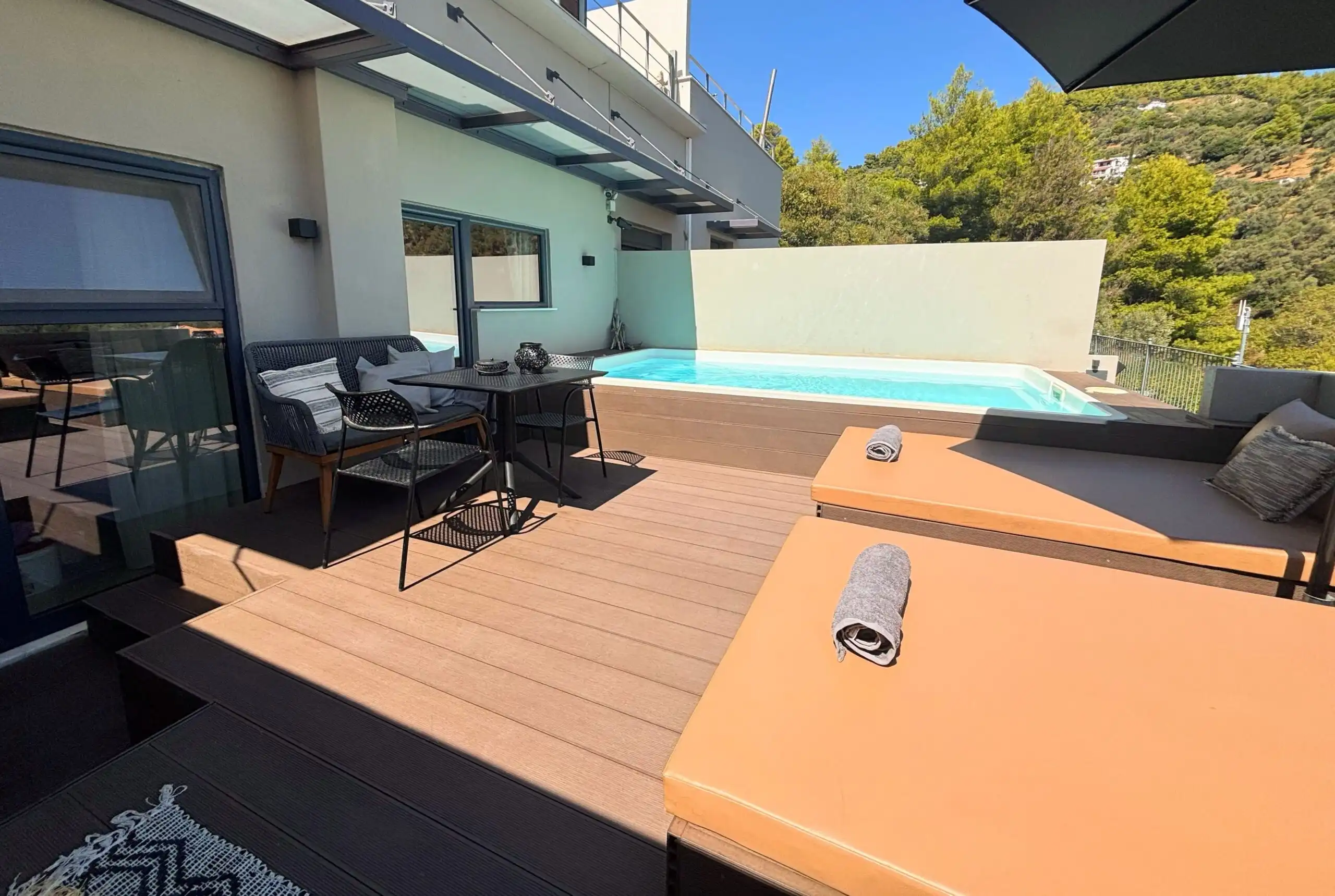 View villa complex with private pool in Skiathos, Greece, offering luxurious living spaces and stunn.