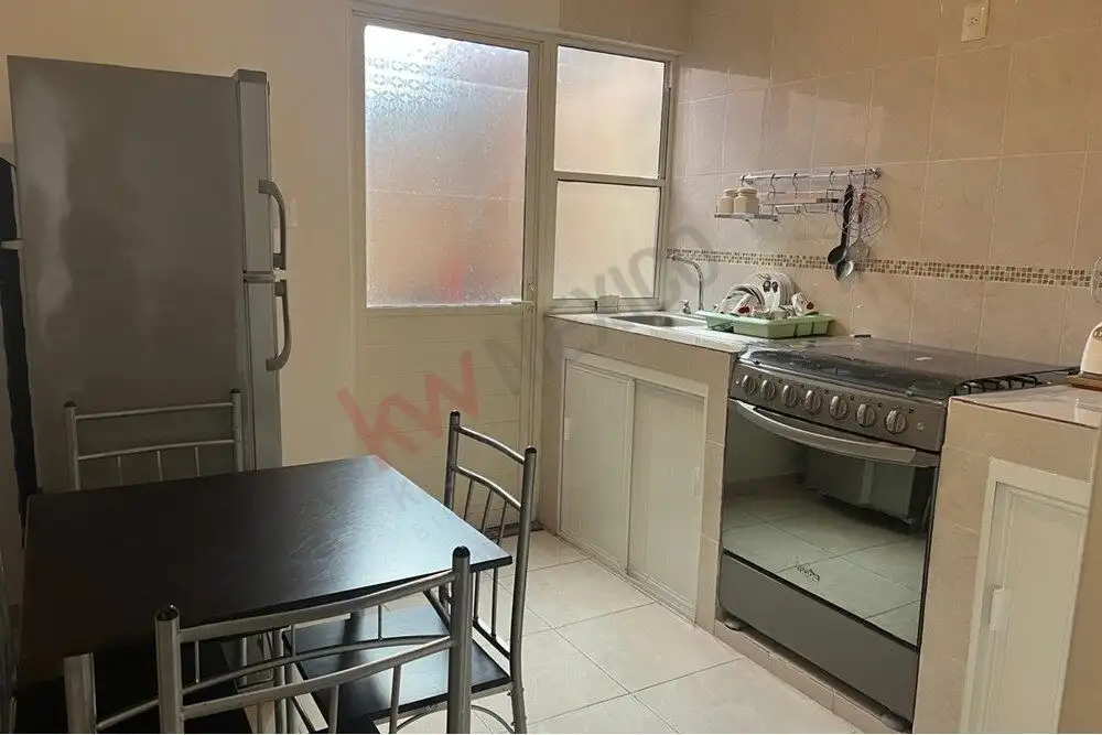 Cozy 2-Bedroom Home in Guadalupe Mexiquito Affordable home for sale in San Miguel de Allende, featuring a compact kitchen and dining area.