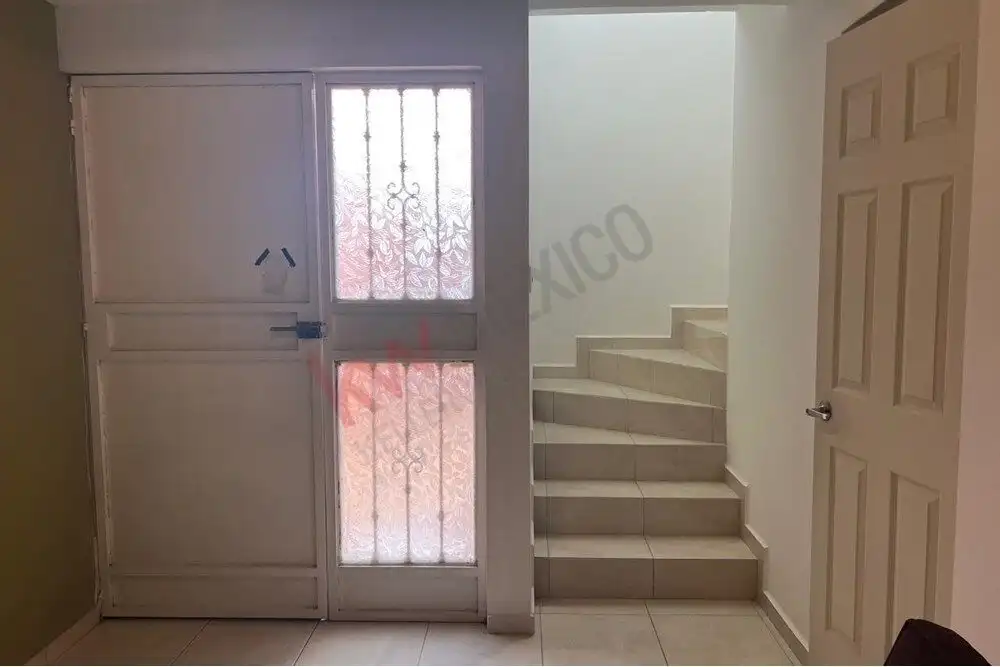 Cozy Home Entrance in San Miguel de Allende Entrance door with security gate and staircase in Guadalupe Mexiquito.