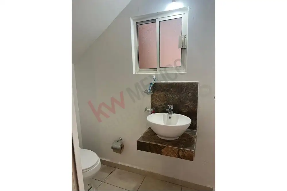 Cozy Bathroom in San Miguel de Allende Modern bathroom with a white sink and small window in Guadalupe Mexiquito.