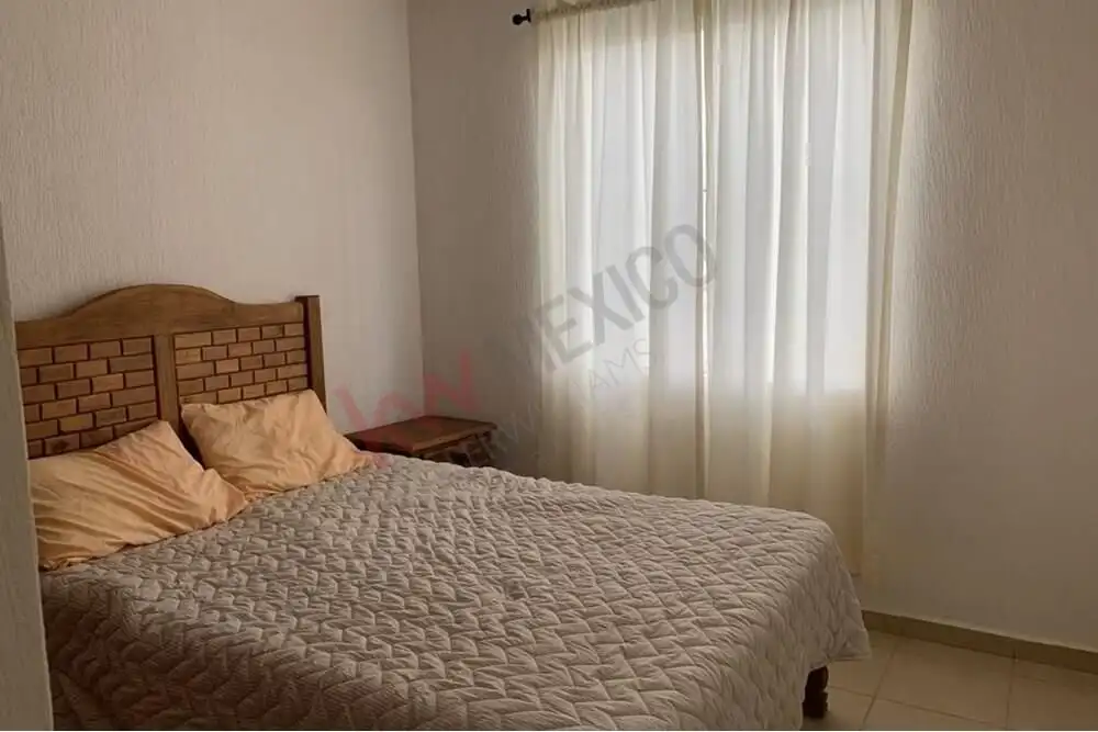 Casa Durazno Bedroom Bedroom with a cozy bed and natural light in San Miguel de Allende.