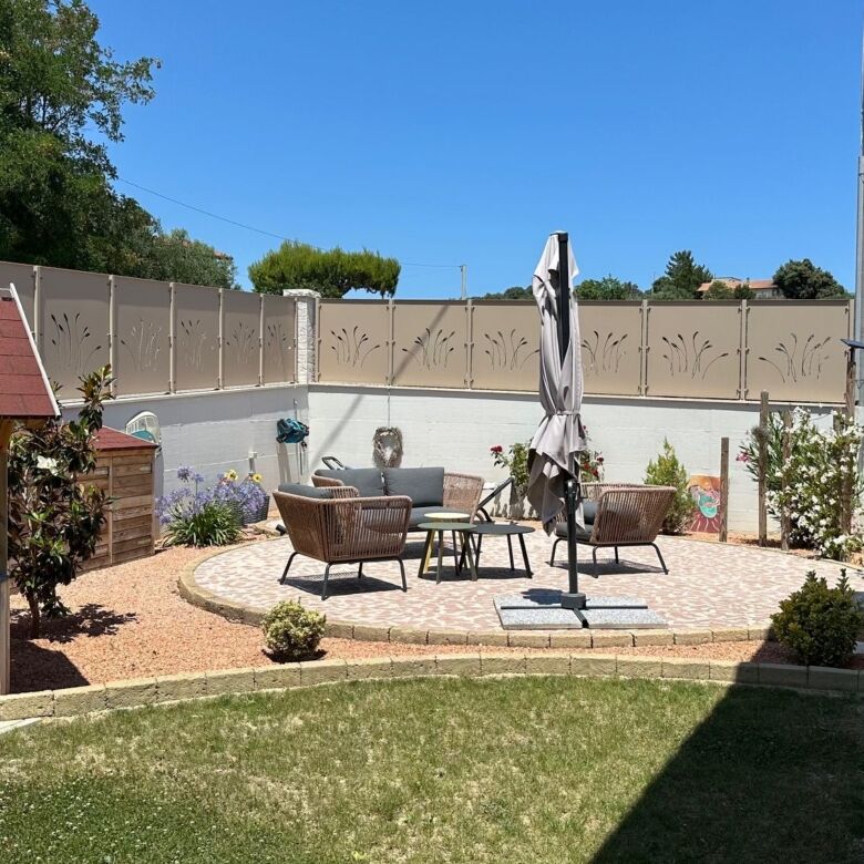 Beautiful outdoor patio with seating area and umbrella in Tortoreto.