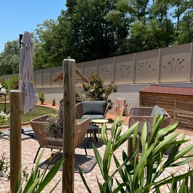 Beautiful outdoor area of a luxury 5-bedroom villa in Tortoreto featuring garden, patio, and seating.