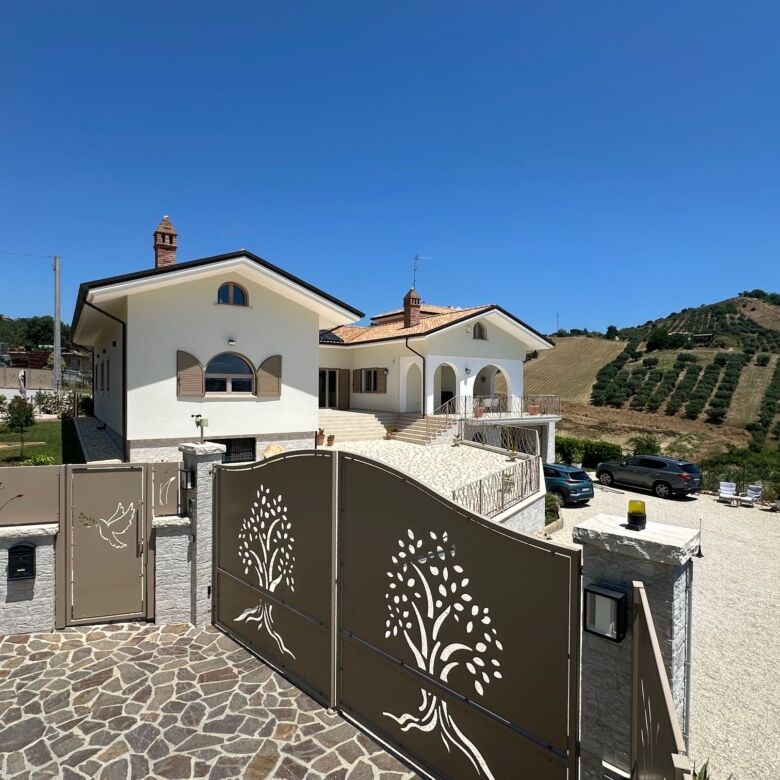 Elegant 5-bedroom villa with modern design in Tortoreto, Italy, offering spacious living and scenic.