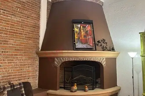 Charming fireplace in a serene single-story home located in Rancho Los Labradores, San Miguel de All.
