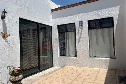 Single-story home with patio and large windows in Rancho Los Labradores, San Miguel de Allende.