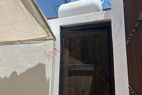Door to serene single-story home in Rancho Los Labradores, San Miguel de Allende, priced at $250,000.