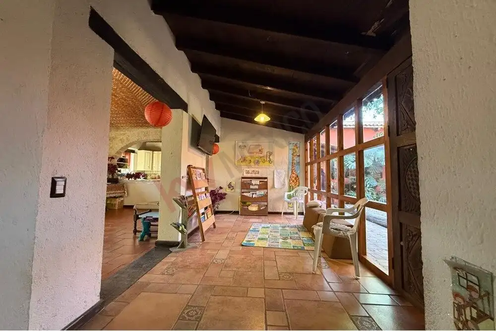 Charming Villa de Los Frailes Home Bright interior with traditional Mexican decor and large windows.