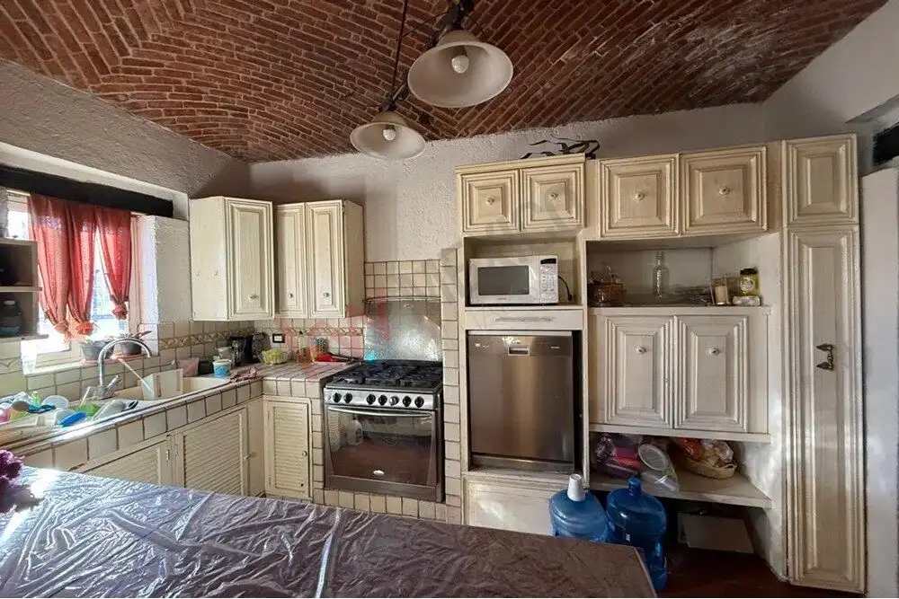 Unit Home Kitchen in Villa de Los Frailes, San Miguel de Allende Spacious kitchen with vintage cabinets, modern appliances, and brick vaulted ceiling in Villa de Los.