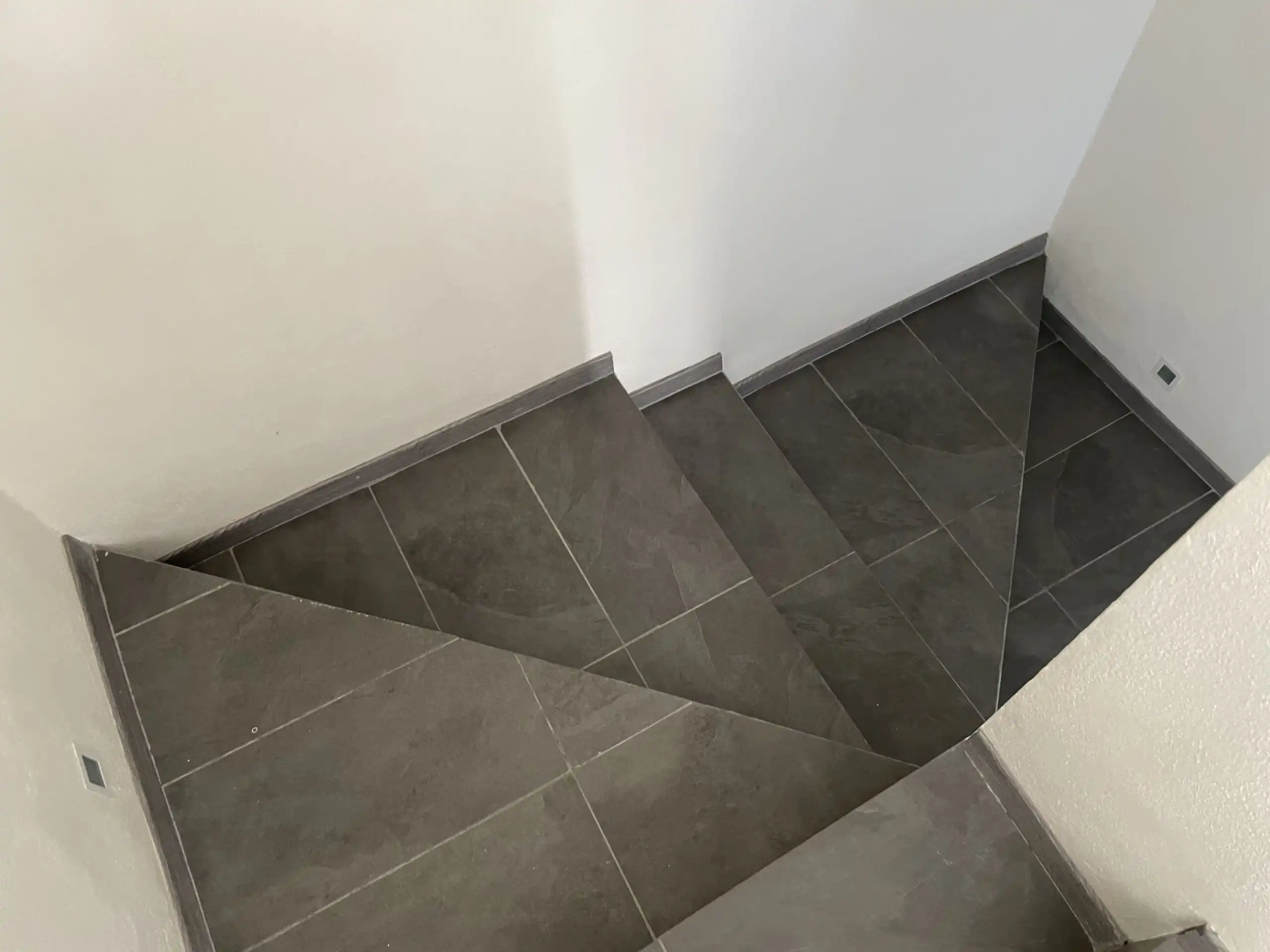 Staircase with dark gray tiles in Residencial Barroco, San Miguel de Allende.