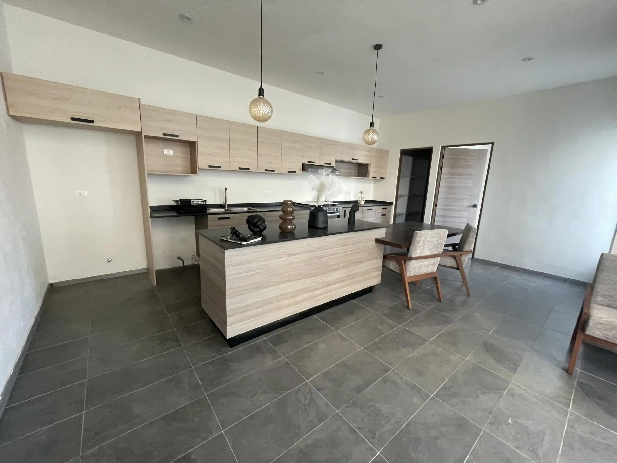 Modern Home Kitchen in Residencial Barroco Spacious kitchen with contemporary design, light wood cabinets, and modern appliances in Residencial.