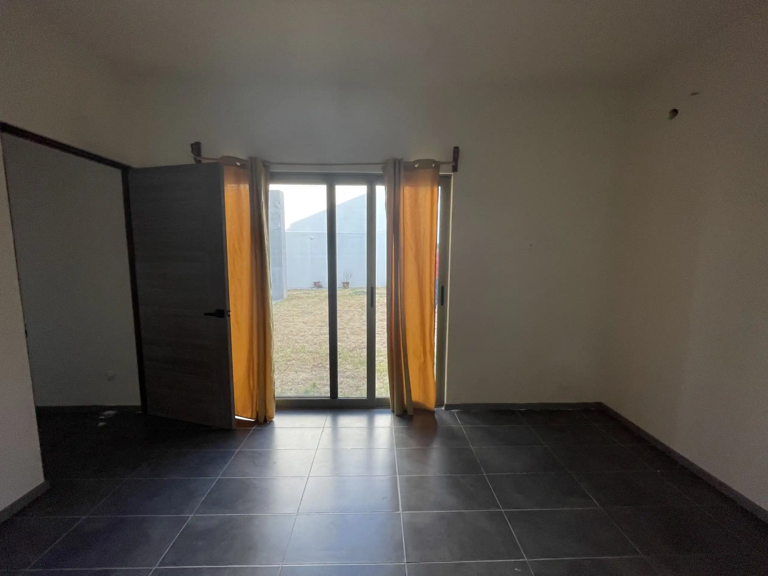 Modern Home Interior with Sliding Glass Doors Modern home interior featuring sliding glass doors opening to a garden in San Miguel de Allende.