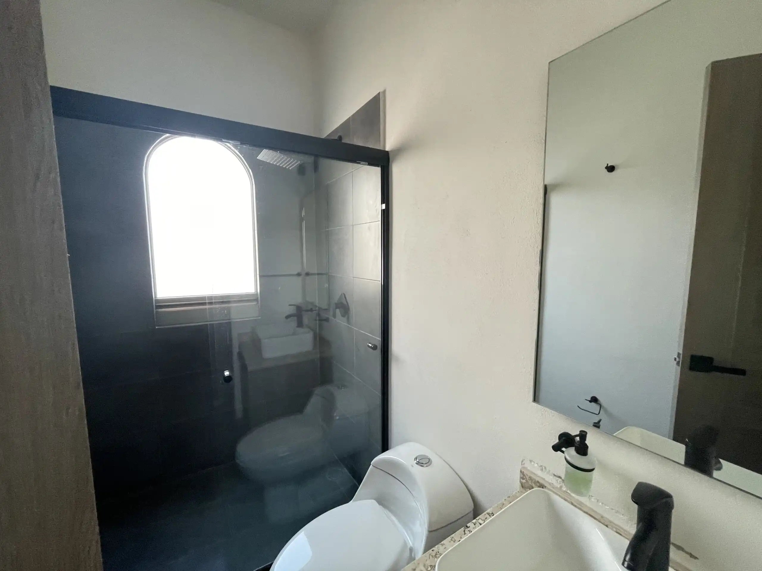Modern Home Bathroom in San Miguel de Allende Bathroom with glass shower enclosure and modern fixtures in Residencial Barroco.