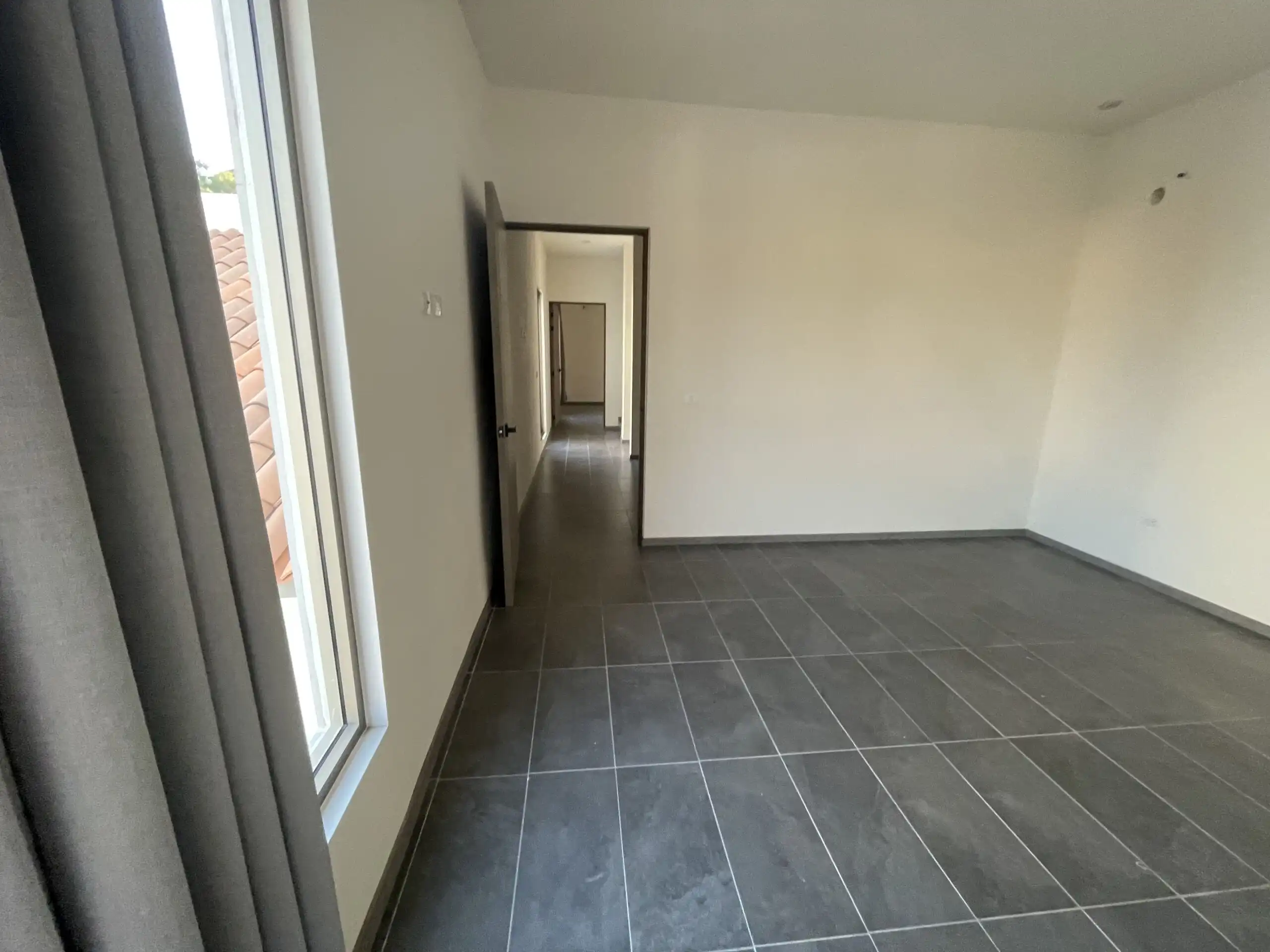 Modern Home Interior in Residencial Barroco Spacious modern home interior with large windows and tiled floors in San Miguel de Allende.