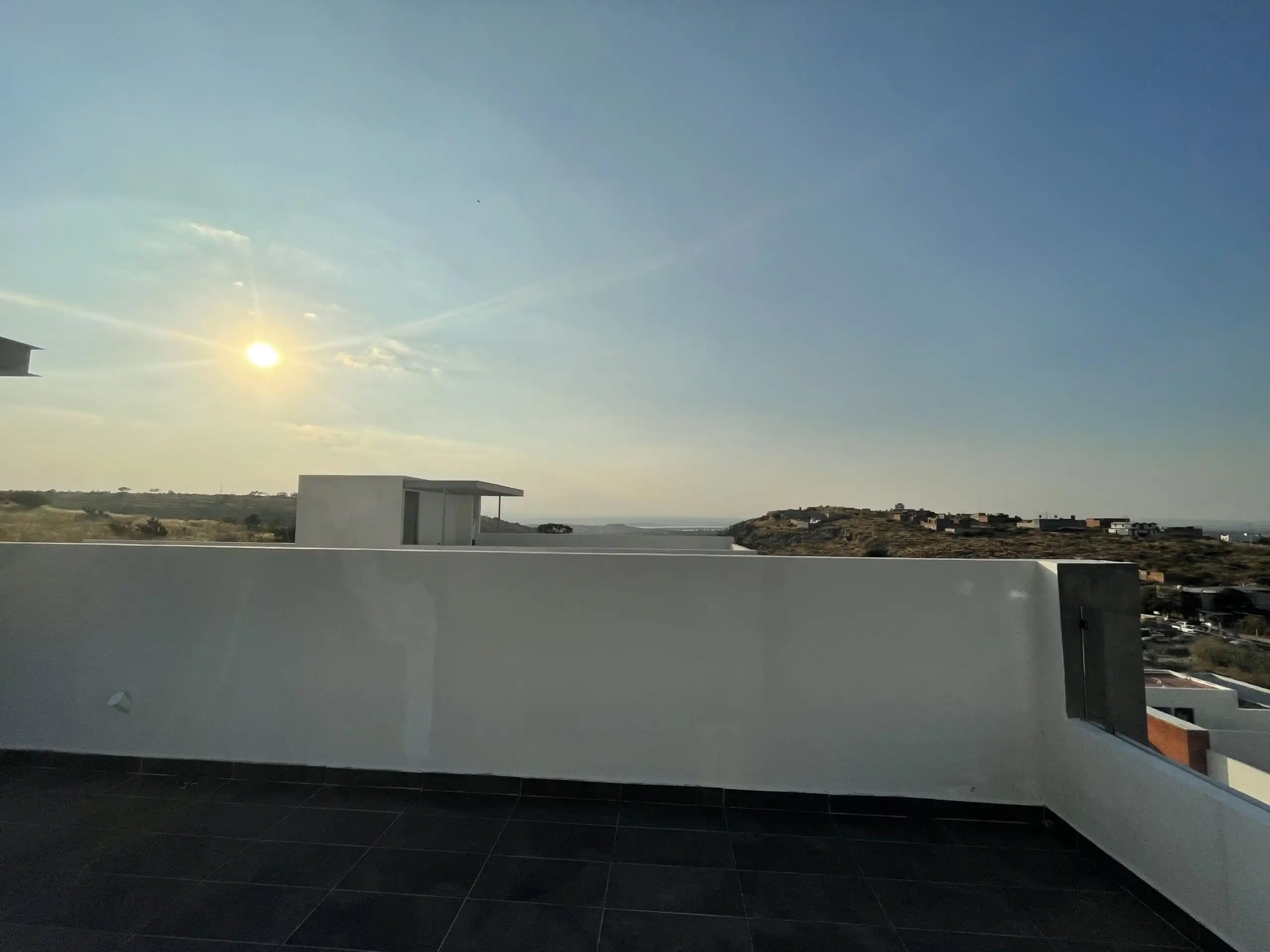 Modern Home Tour in Residencial Barroco Modern home with rooftop terrace overlooking San Miguel de Allende at sunset.