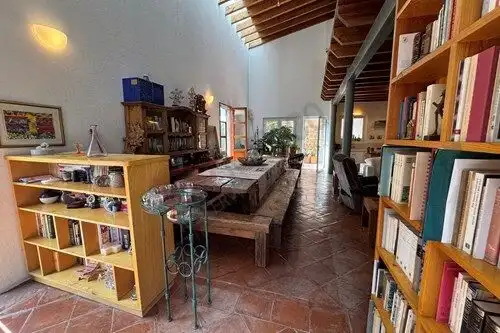 Cozy fully furnished loft with rustic wooden beams, ample natural light, and stylish decor in San Mi.