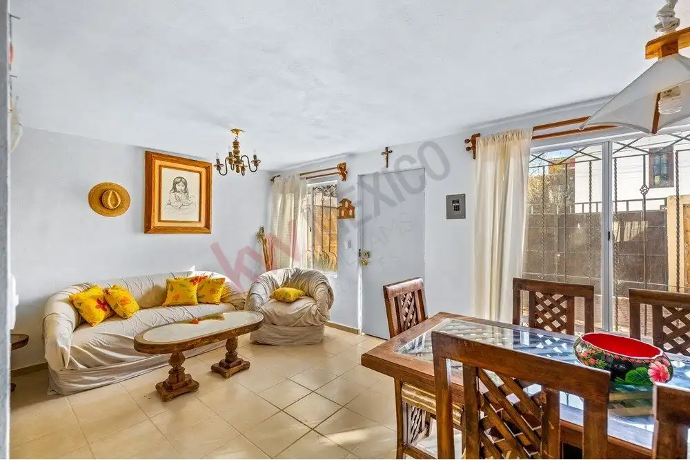Bright living room with comfortable seating and natural light, located near Centro in San Miguel de.