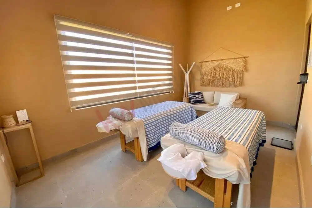 Interior view of a modern ground-floor apartment with two beds in Arcos de San Miguel.