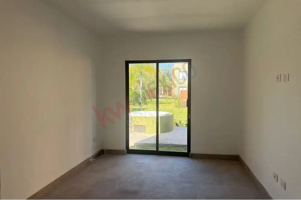 Apartment with sliding glass door leading to outdoor space in Arcos de San Miguel.