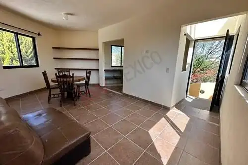 Spacious living room with large windows and natural light in Rancho Los Labradores.