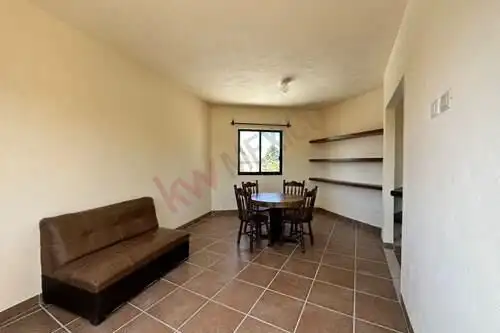 Cozy living room with dining area and built-in shelves in Rancho Los Labradores, San Miguel de Allen.