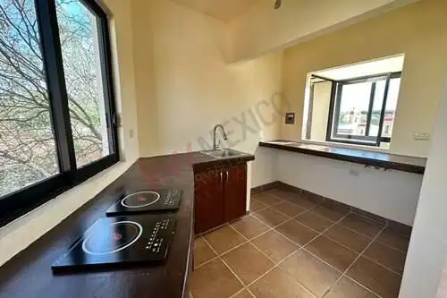 Spacious kitchen with large windows and modern appliances in Rancho Los Labradores, San Miguel de Al.