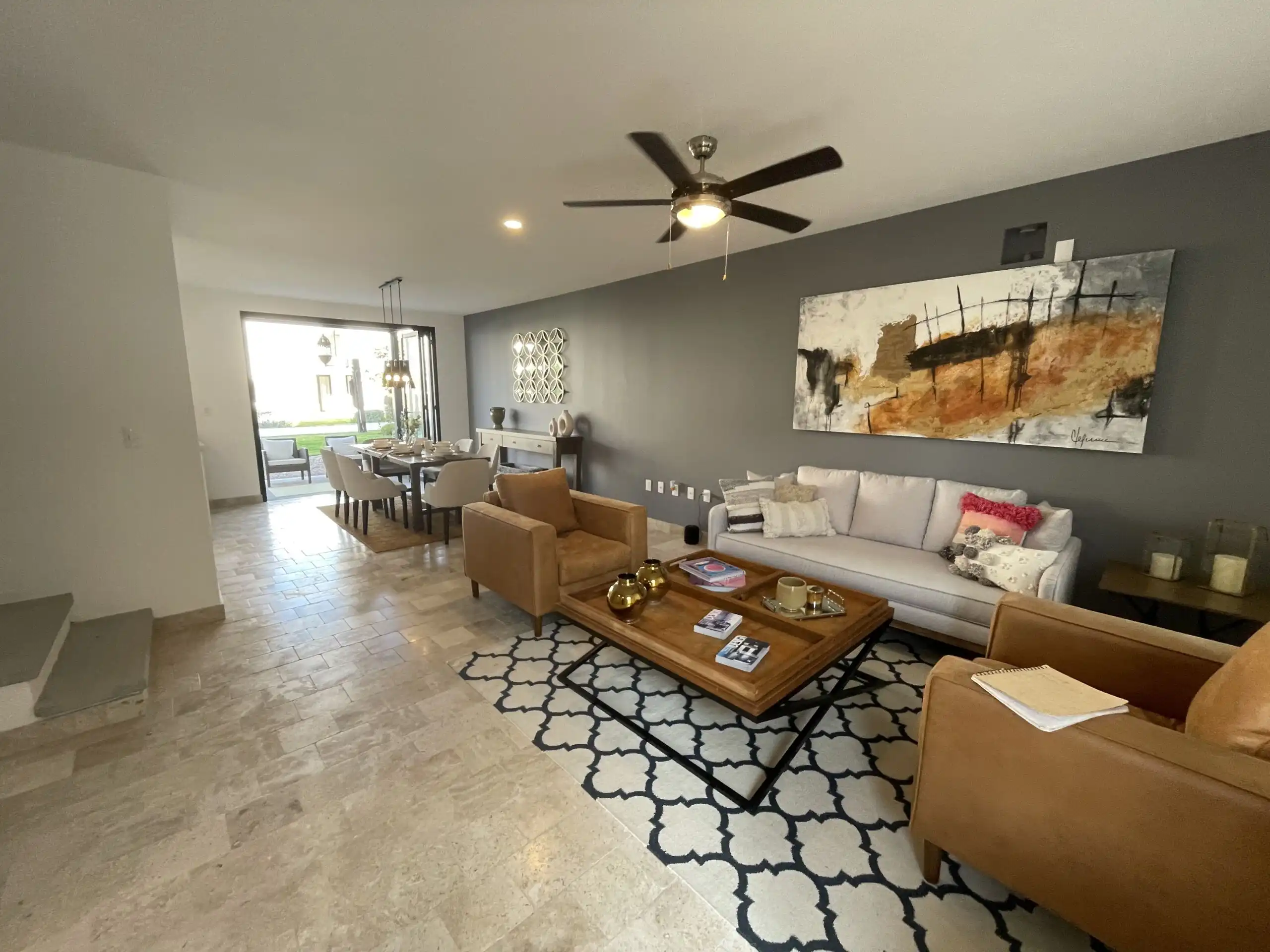 Spacious living room in Casa Santa Elena with modern decor and heated pool access.