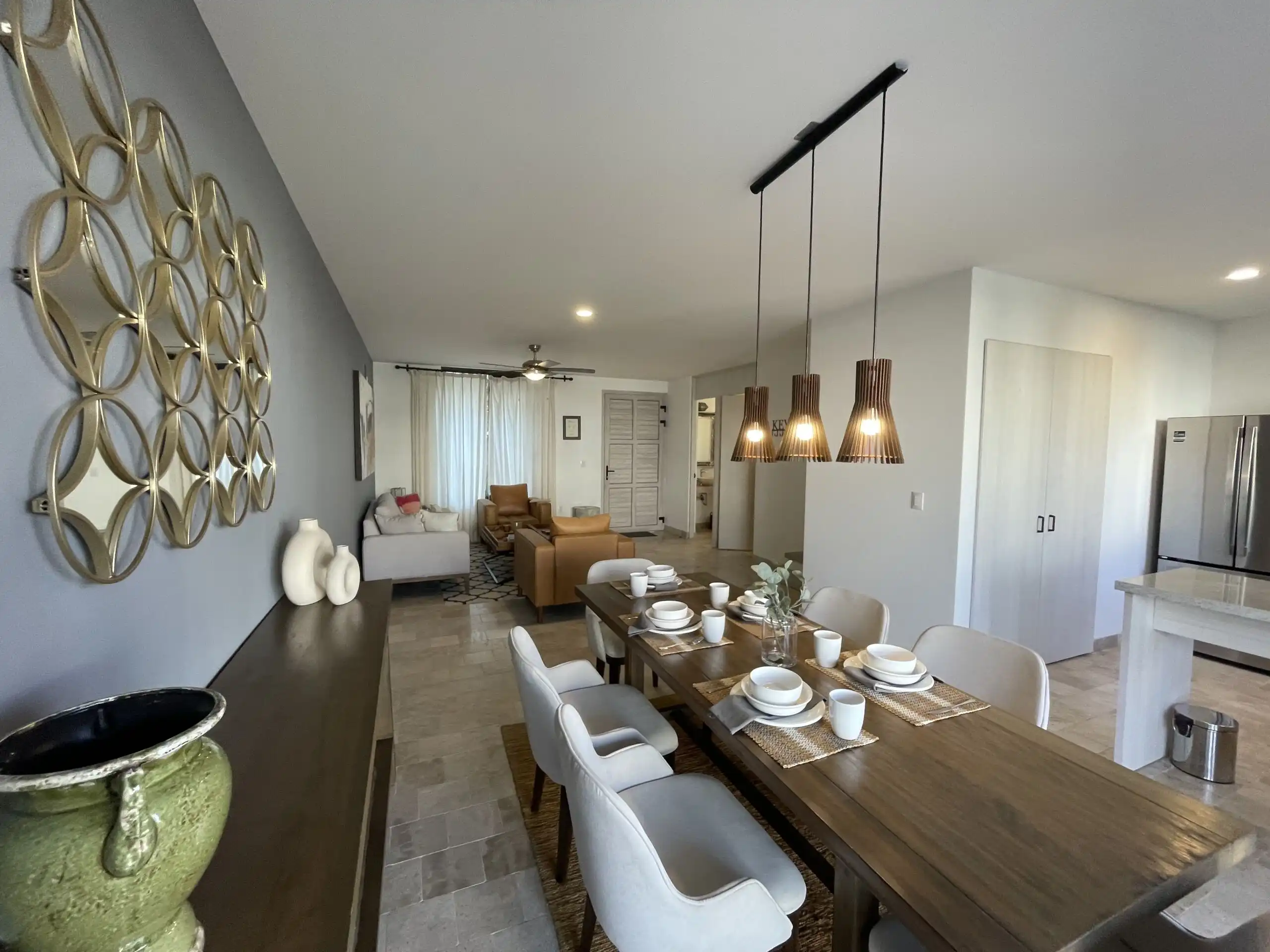 Spacious interior of Casa Santa Elena featuring modern decor, a large dining area, and luxurious ame.