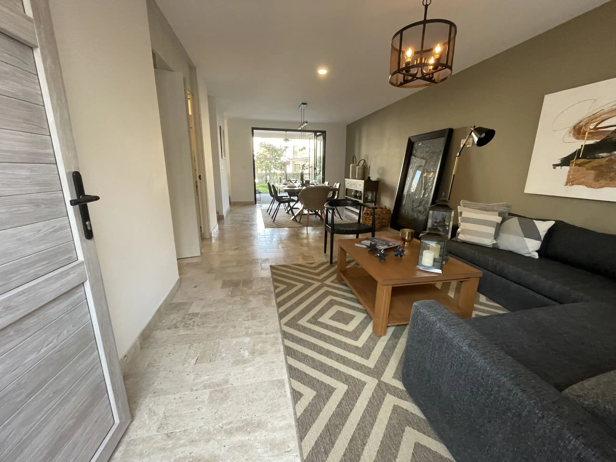 Modern living room with stylish decor and spacious layout in La Luminaria. Elegant interior with comfortable seating and contemporary design.