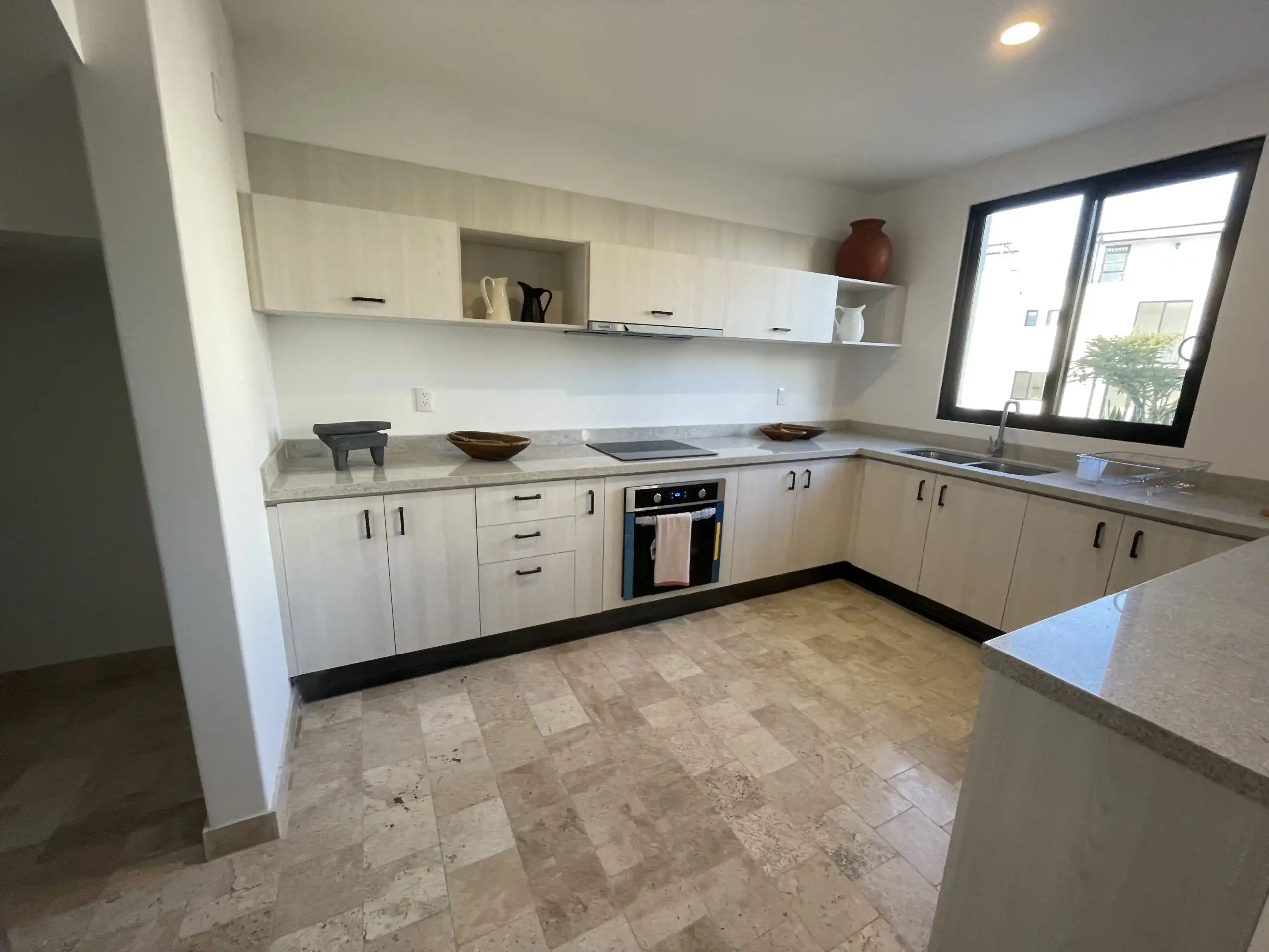 Modern white kitchen with ample storage and natural light in San Miguel de Allende. Modern white kitchen with ample storage and natural light in San Miguel de Allende.