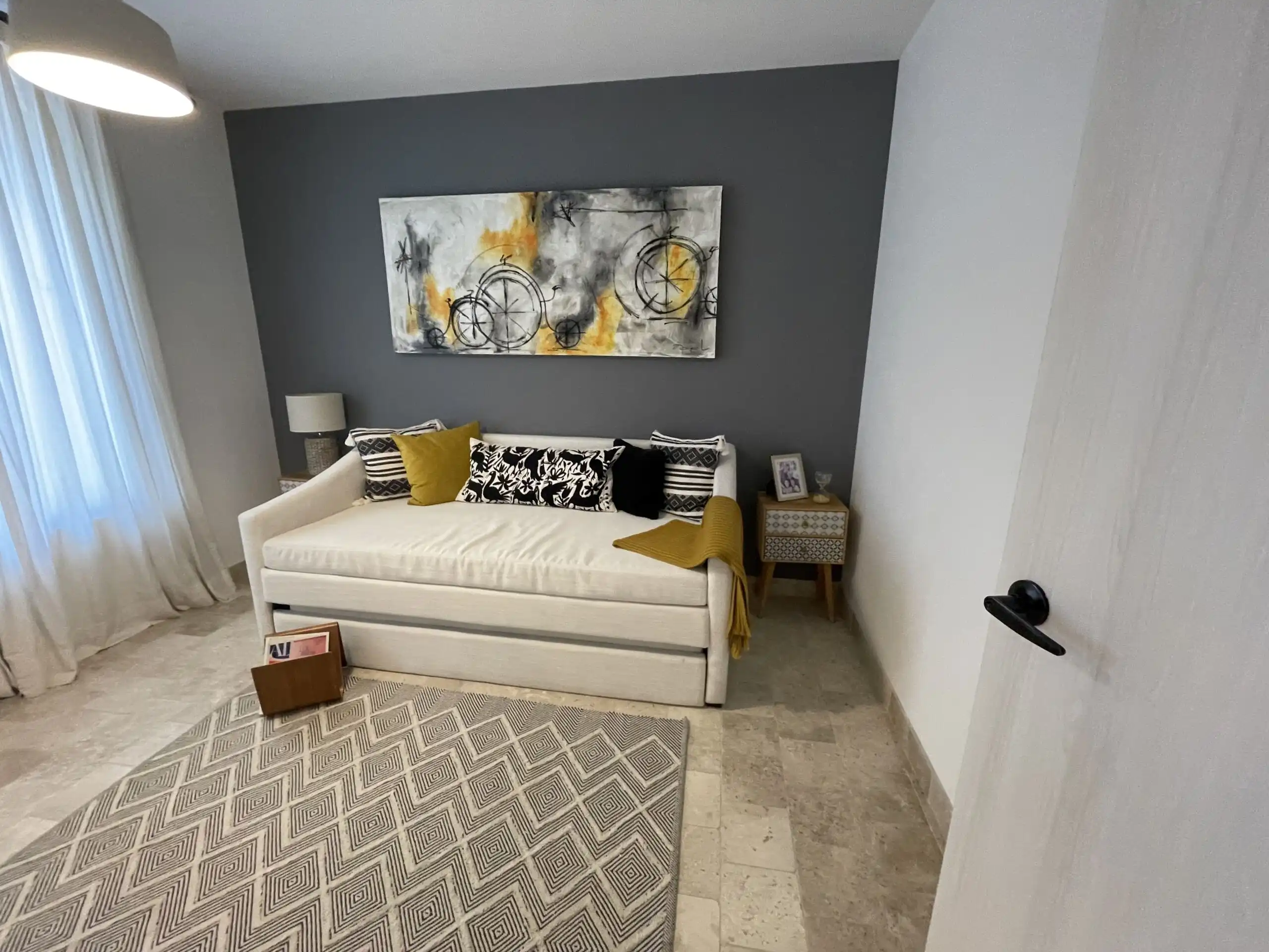 Luxury Home Interior with Modern Decor and Cozy Sofa Modern living room with stylish sofa, abstract artwork, and natural light in La Luminaria, San Migue.